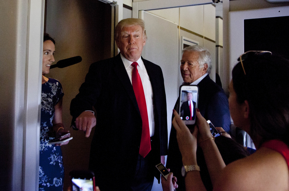 New England Patriots owner Robert Kraft stands next to President Trump aboard Air Force One in Palm Beach, Fla., on March 19, 2017.