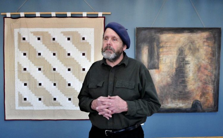 Michael Libby discusses his art and his project "On Getting High: Mapping Addiction at Home," displayed Thursday at Thomas College in Waterville. The artwork is his response to the opiate crisis and its impact on families, including his own.