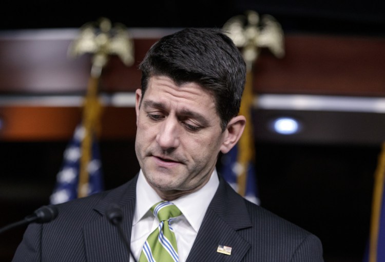 House Speaker Paul Ryan pauses Friday as he announces that he is abruptly pulling the Republican health care overhaul bill off the House floor.