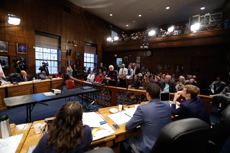People line up to give testimony on the Portland school bond proposal during Monday night's City Council meeting.