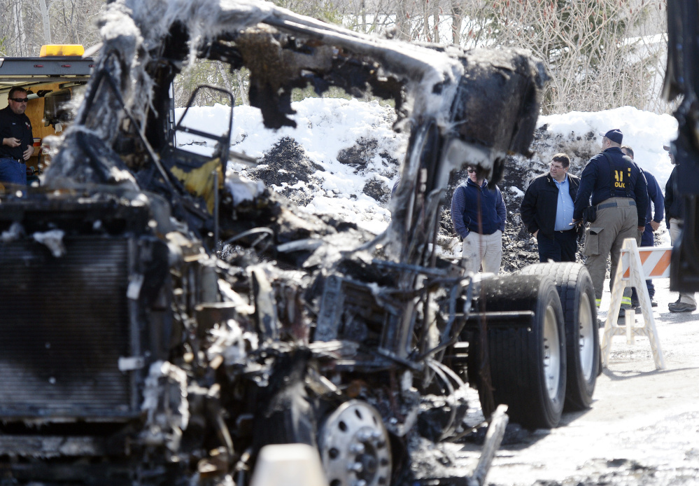 Six tractor-trailers were destroyed and two others were damaged in nearly simultaneous fires at R.C. Moore depots in Poland, above, and Scarborough Sunday night.