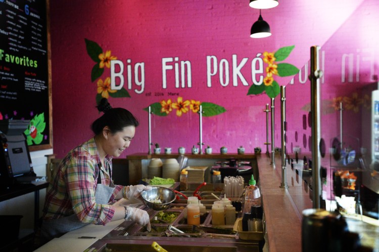 Samantha Liang prepares a poké bowl at Big Fin Poke in Westbrook.