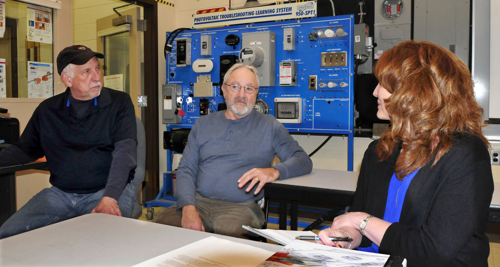 Officials say the solar design program at Kennebec Valley Community College in Fairfield is thriving. Speaking in front of a photovoltaic system are instructors Keven Vachon, left, Rich Roughgarden and program coordinator Robin Weeks on Thursday.