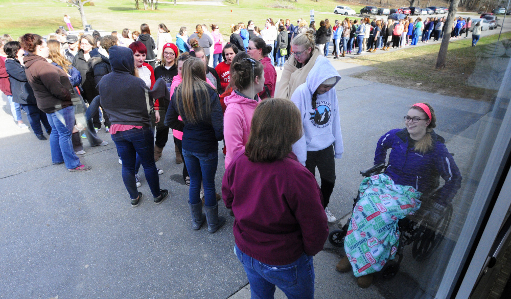 Brianna Cobb, far right, is first in line Saturday for the Cinderella Project of Maine prom gown giveaway at Gardiner Area High School. Her group arrived at around 5:45 a.m.