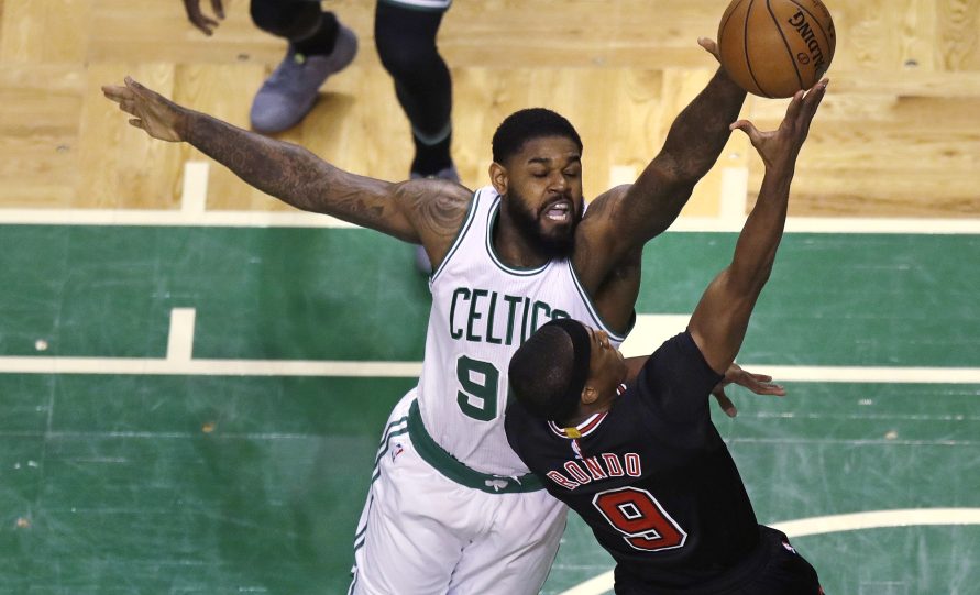 Boston Celtics forward Amir Johnson blocks a shot by Chicago Bulls guard Rajon Rondo during the first quarter in Boston on Tuesday.