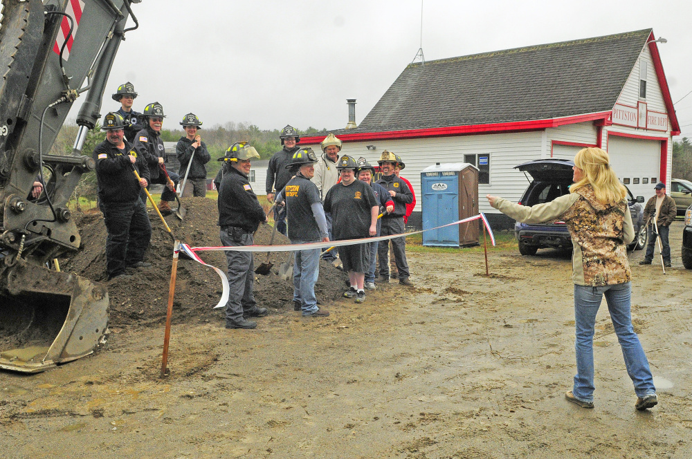 Firefighters take part in a groundbreaking Saturday for a fire station to replace the old one in East Pittston. The building will be farther back from the road so trucks don't block traffic.