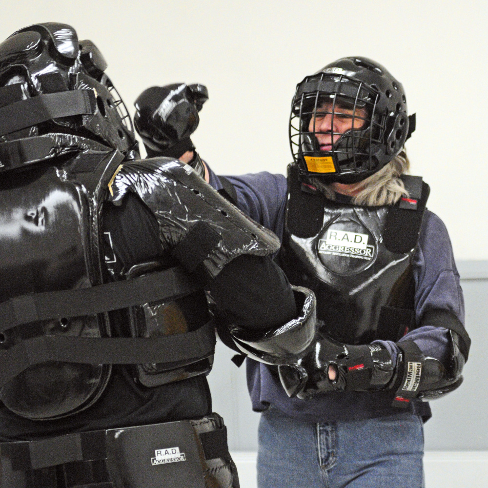 Brenda Larrabee practices fending off an attacker. The class included other lessons for students on rape prevention.