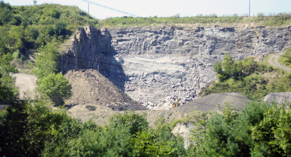The McGee pit in Augusta is seen from east side of the Kennebec River in September 2015. Blasting at the site has provoked ongoing complaints from nearby residents.