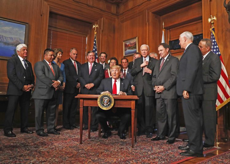 Gov. Paul LePage, at far right, was among the people attending a ceremony in Washington, D.C., at which President Trump signed an executive order asking for a review of the designation of tens of millions of acres of land as national monuments on Wednesday.