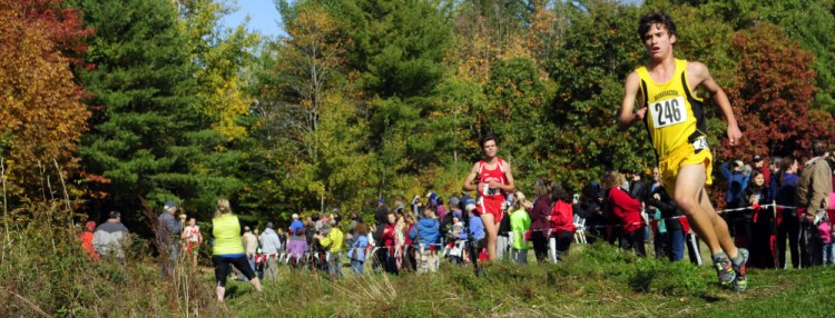 Ruslan Reiter rounds a corner on his way to a third-place finish in the Kennebec Valley Athletics Conference Class B cross country championships in October at Cony High in Augusta.