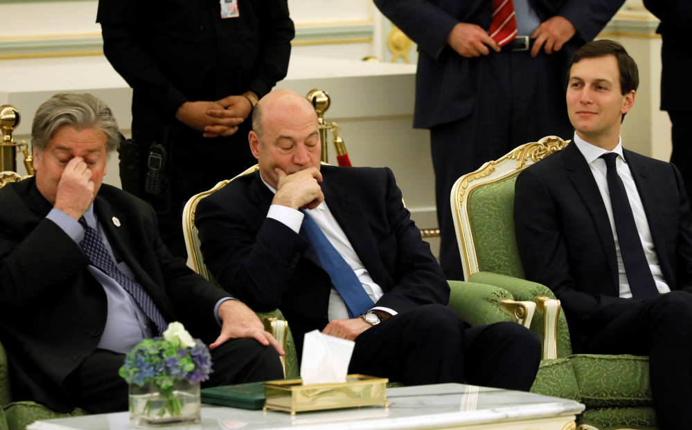 White House senior advisor Jared Kushner, right, enjoys the ceremony with flanked senior adviser Steve Bannon, left, and and chief economic advisor Gary Cohn. , attends a signing ceremony between Saudi Arabia's King Salman bin Abdulaziz Al Saud and U.S. President Donald Trump at the Royal Court in Riyadh, Saudi Arabia May 20, 2017. REUTERS/Jonathan Ernst - RTX36QJT