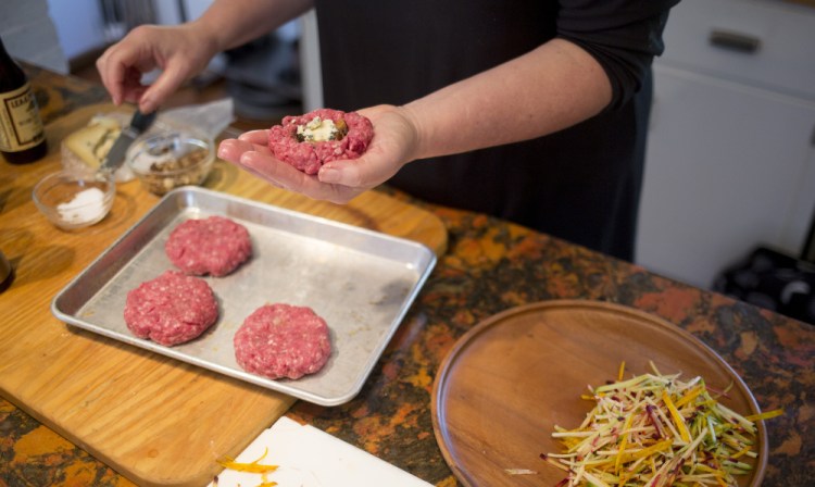 Christine Burns Rudalevige stuffs burger patties with blue cheese and chopped mushrooms and onions.