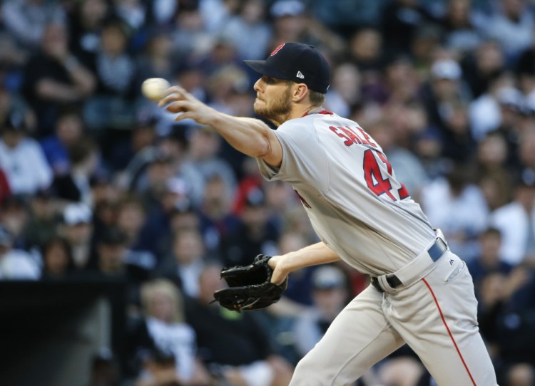 Red Sox starting pitcher Chris Sale allowed five earned runs in five innings in his first start against his former team, the Chicago White Sox, on Tuesday in Chicago. The Red Sox won 13-7.