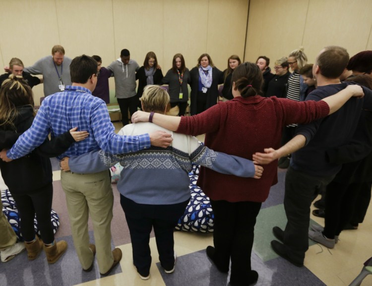 Students and teachers gather in Indianapolis in support of students returning to school after treatment for addiction. 