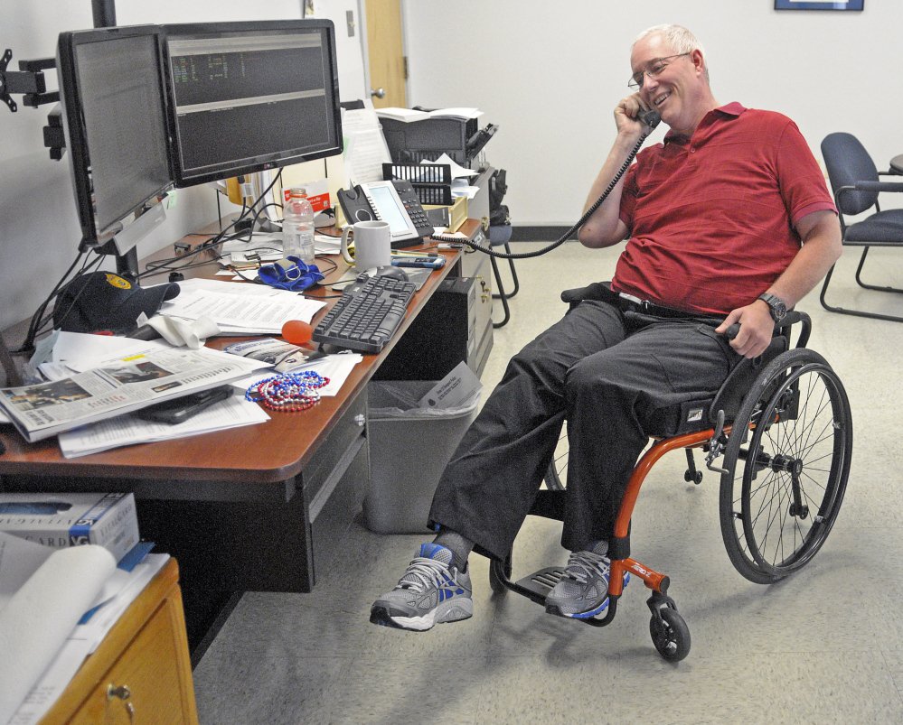 Augusta Police Chief Robert Gregoire does leg exercises while talking on the phone.