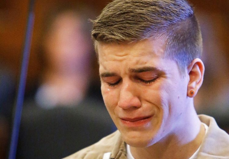 Eugene Martineau weeps during his sentencing for the death of his infant son, in Cumberland County Superior Court in Portland on Tuesday. Martineau will spend 15 years in prison.