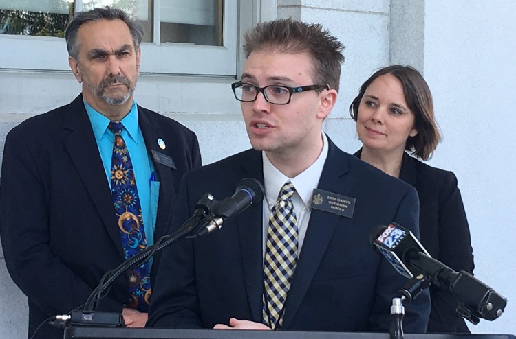 Sen. Justin Chenette, D-Saco, speaks about a bill he supports that's before the Maine Legislature that would prohibit internet service providers from selling or sharing subscribers' browsing history and other data without consent, on Tuesday in Augusta. Standing behind Chenette, from left, are Sen. David Miramant, D- Camden, and the bill's author, Sen. Shenna Bellows, D-Manchester.