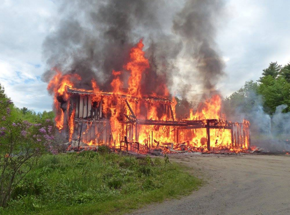 Flames engulf a home Friday night on North Wayne Road in Wayne. Assistant Fire Chief Jim Welch said no one was injured in the blaze, which destroyed the house and garage.