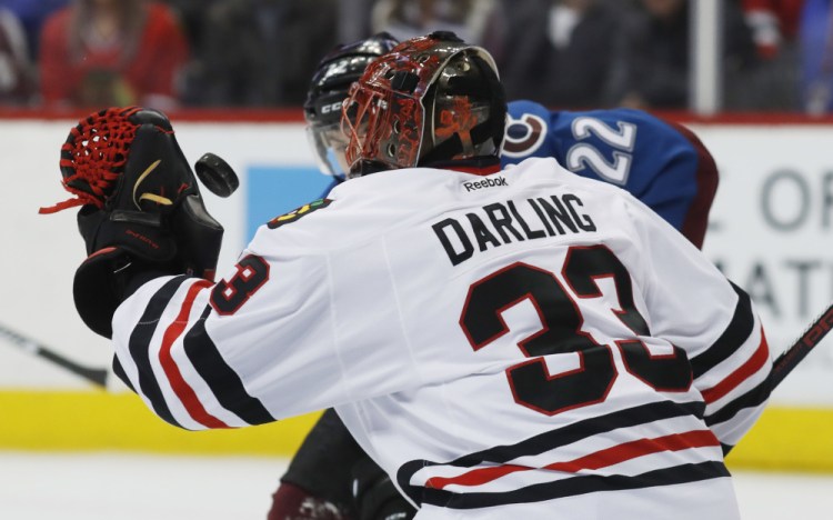 Scott Darling, the former UMaine goalie, wanted to keep No. 33 after moving from Chicago to Carolina. He got it after bargaining through Twitter with a new teammate.