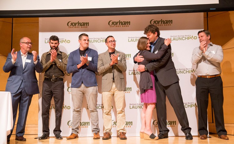 Jennifer Scism and David Koorits, owners of Good To-Go in Kittery, embrace as they're announced as the winners of Gorham Savings Bank's $50,000 LaunchPad prize.