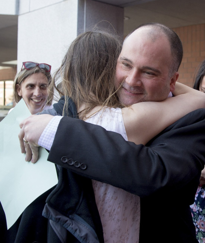 Family members greet Anthony Sanborn upon his release on bail April 13 after evidence called into question his 1992 murder conviction.