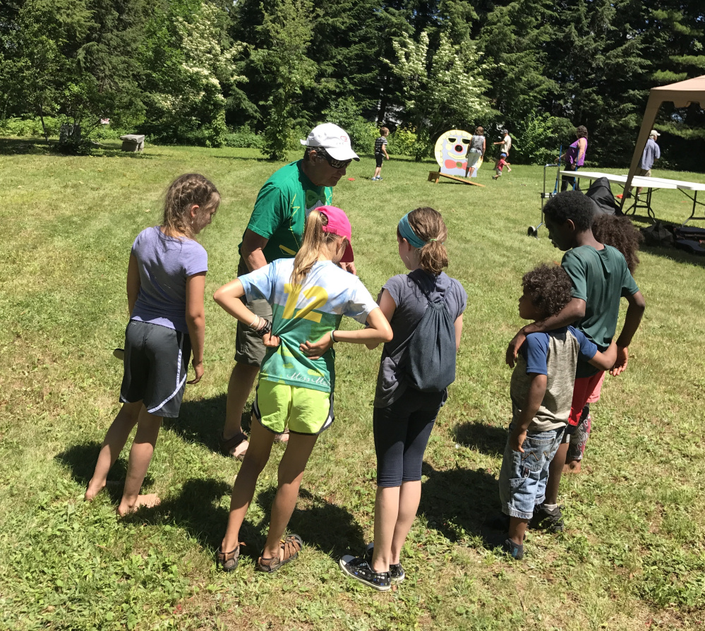 Peter Walsh, the emcee for Dresden SummerFest, explains the rules of the foot race Sunday at the Pownalborough Court House. The key to pulling off the annual community event? Avoid overplanning, Walsh says.