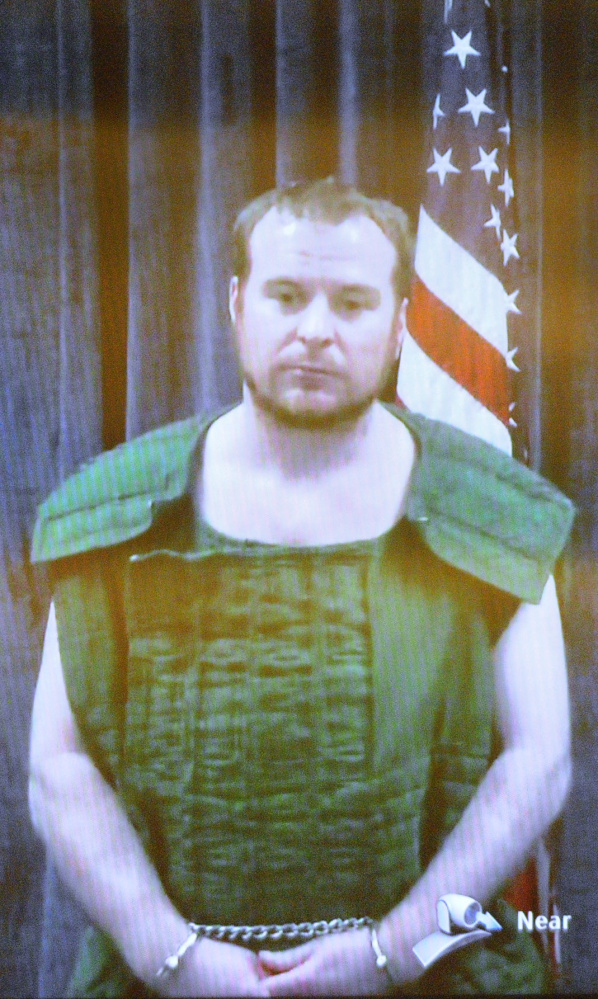 Jeremy Clement appears on video from the Kennebec County jail during his April 21 court appearance on assault and burglary charges.