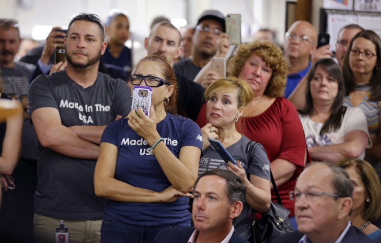 Workers at the New Balance athletic shoe factory in Lawrence, Mass., listen as U.S. House Speaker Paul Ryan, R-Wis., advocates drastic changes in the national tax code after touring the facility Thursday.