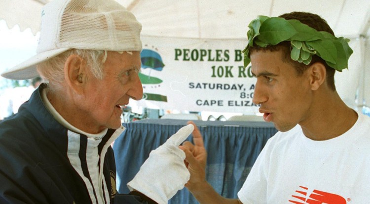 Running legend Johnny Kelley, left, talks with men's elite winner Khalid Khannouchi after the race.