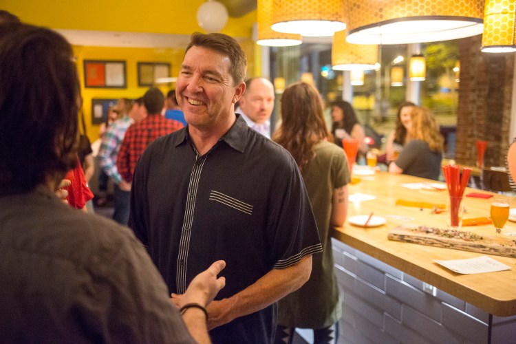 Matt Jacobson, executive director of the Maine Lobster Marketing Collaborative, talks with San Francisco restaurant owner Stuart Brioza at the "Maine After Midnight" event at the downtown Portland restaurant The Honey Paw on June 12.