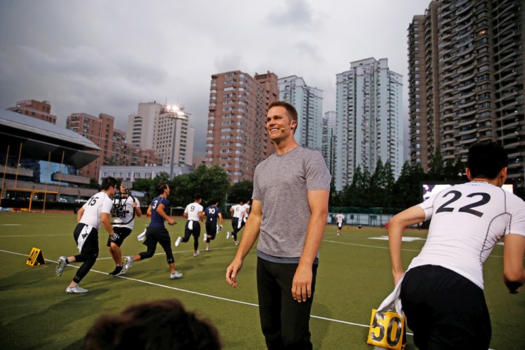 Tom Brady takes part in a promotional training event in Shanghai, China, on June 20, 2017.  Having the greatest quarterback in the sport's history available all season will be a good thing for the Patriots, right? Well, perhaps.