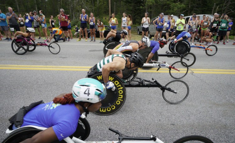 Wheelchair racers pull away from the starting line at the 20th TD Beach to Beacon 10K road race in Cape Elizabeth on Saturday. (Staff Photo by Gregory Rec/Staff Photographer)