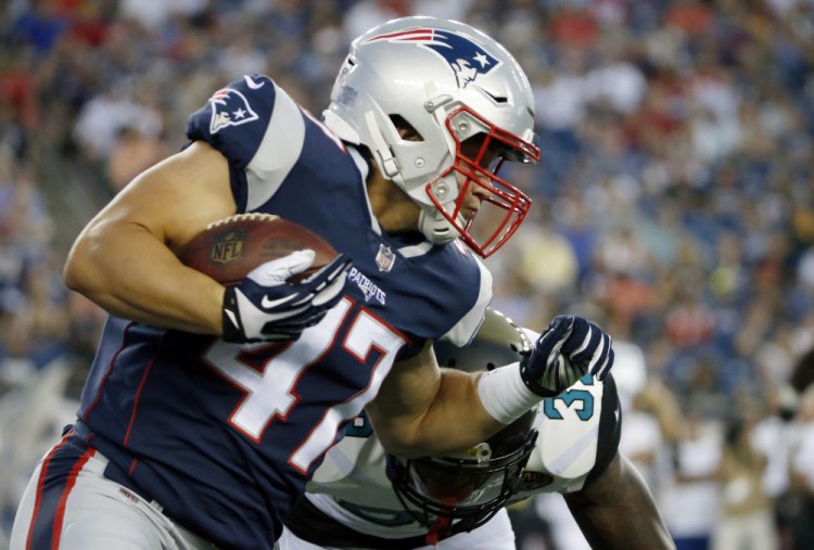 Patriots fullback Glenn Gronkowski carries the ball on a 10-yard reception during last Thursday's preseason game against Jacksonville. Gronkowski is hoping to stick.