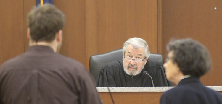 Justice Donald Marden accepted a conditional guilty plea from Travis Gerrier, left, 23, of Belgrade, on Monday to charges that he sexually assaulted an 11-year-old in June 2015. Gerrier is represented by attorney Sherry Tash, right.