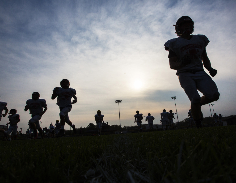 Scarborough High football players run sprints at the end of practice last week. With a deep squad that includes nine returning starters on offense and six on defense, the Red Storm are hoping this is the year they rise to the top of Class A South.