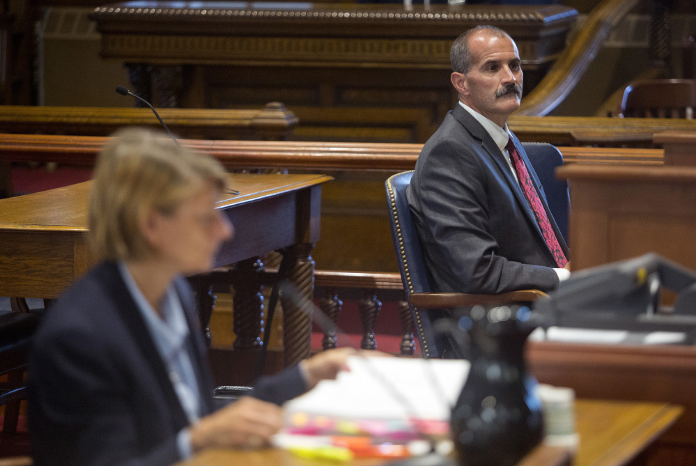 Attorneys, from left, Anne-Marie L. Storey and Norman G. Trask wait for the judges to appear before arguing their case,  Gaetan H. Bourgoin v. Twin Rivers Paper Co., Wednesday at the Maine Supreme Judicial Court. Storey argued for the appellant, Twin Rivers Paper Co., and Trask argued for Bourgoin.