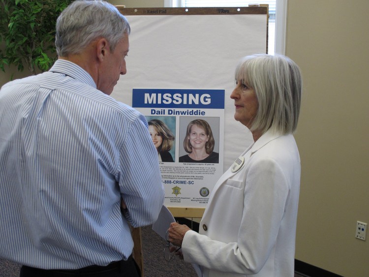 Jean Dinwiddie talks to WIS-TV reporter Jack Kuenzie about a new photo of what her daughter Dale Dinwiddie might look on Aug. 13, 2012, in Columbia, S.C. Dail Dinwiddie was last seen at a Columbia bar after watching a U2 concert in September 1993. 