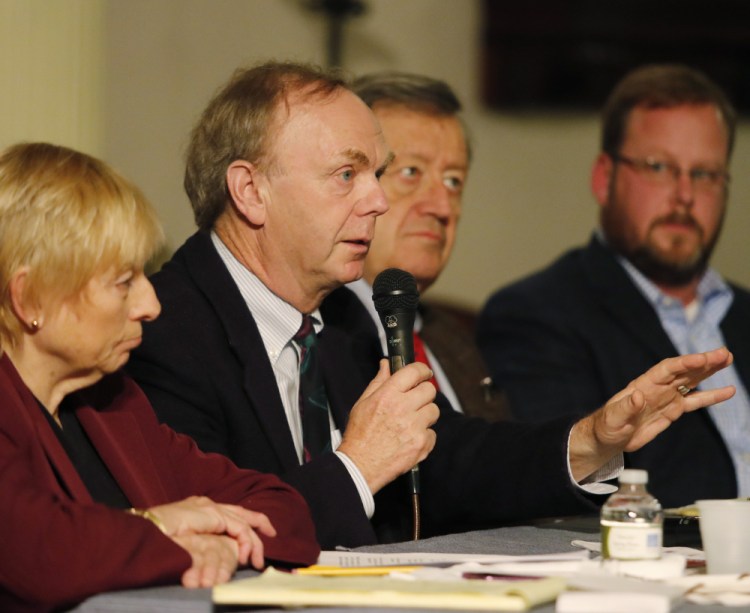 Alan Caron, center, shown at a forum last year, said on Facebook that he plans to run for "a major office in Maine," though he didn't specify which office.