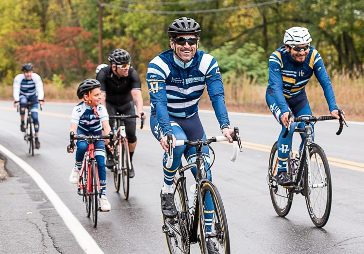 Patrick Dempsey rides down Riverside Drive in Auburn on the first leg of his Dempsey Challenge bike ride Sunday.