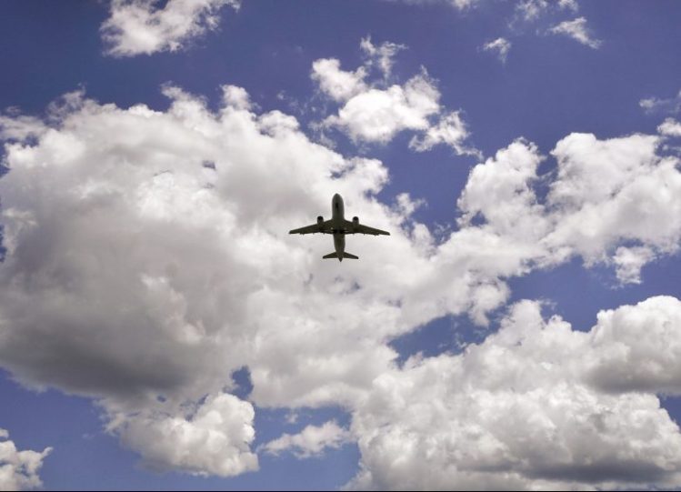 An airliner takes off from the Portland International Jetport in June. Flights depart to the west unless the FAA radar in Gray is out and they are required to fly east over the harbor.