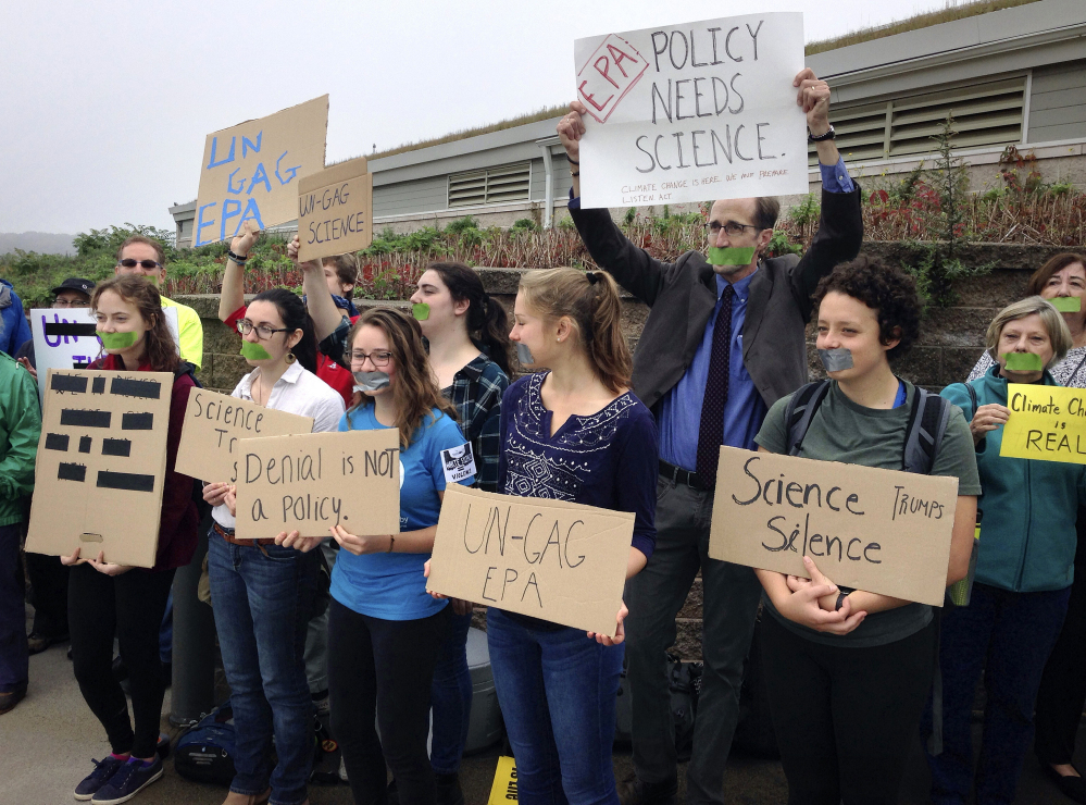 Protesters gather outside a meeting where a report about Narragansett Bay that included the effects of climate change was to be released Monday  in Providence, R.I. The Environmental Protection Agency prevented three of its scientists, who had been expected to discuss the report, from speaking at the event.