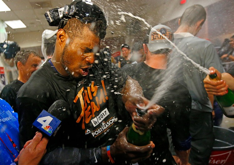 Los Angeles Dodgers' Yasiel Puig celebrates in the clubhouse after game 3 of the National League Division Series against the Arizona Diamondbacks, Monday in Phoenix. 