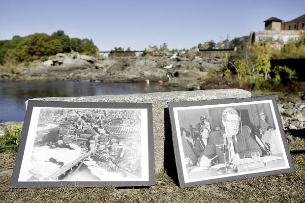 Pictures of U.S. Sen. Edmund Muskie of Maine and of pollution piled up below the Great Falls in Lewiston and Auburn sit near the riverbank during a news conference Tuesday.