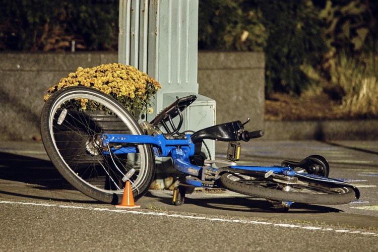 A bicycle lies on a New York bike path at the scene where eight people were struck and killed Tuesday. None of the screening measures pushed by President Trump would have kept out the alleged attacker, a Muslim immigrant who entered the U.S. legally from a country that's not on the list of those singled out for extreme vetting by the Trump administration.