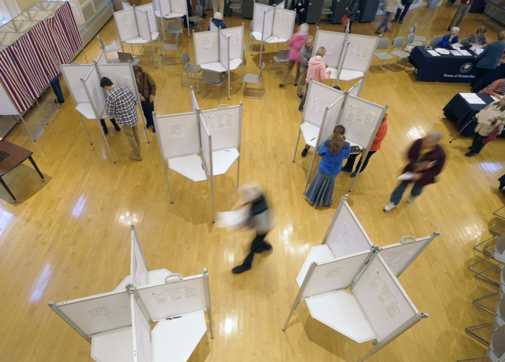 Kennebunk residents vote at Kennebunk Town Hall on Tuesday afternoon. Secretary of State Matt Dunlap spent the day visiting polling places. He agreed that turnout seemed to be higher than expected for an off year, with no statewide or national candidates on the ballot. "Things have been smooth and quiet so far," he said.