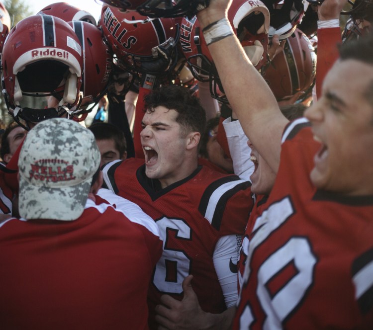 Michael Wrigley, center, and his Wells teammates are headed to their second straight state final – this time in Class D.