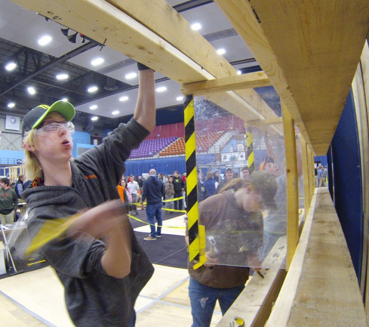 Noah Forget, of Oxford Hills, pounds nails Friday during a contest at the 18th Annual Crafts Championships at the Augusta Civic Center.