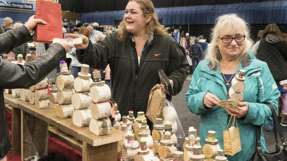 Wendy Struck, left, of Livermore Falls shops with her mother, Brenda, of Readfield at the Misfit Snowman booth.