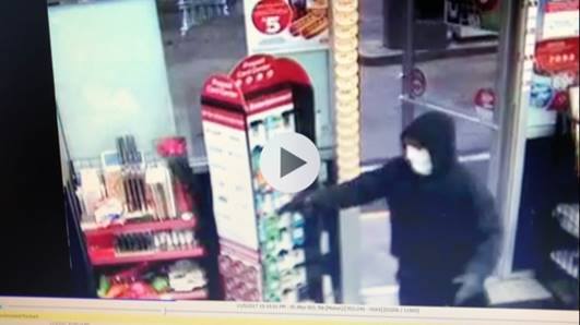 A man wearing a white mask robbed the South Portland Circle K at gunpoint Sunday.