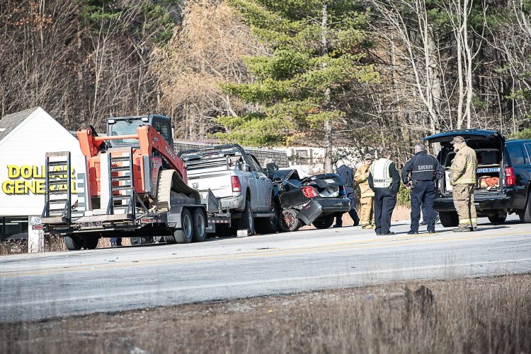 Emergency personnel and law enforcement gather at the scene of a fatal car accident in Turner on Wednesday morning. 